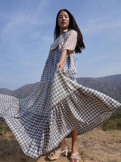 Woman wearing the Sutra 4-Check Maxi Dress — a checked cotton maxi dress with a shirt collar and button placket