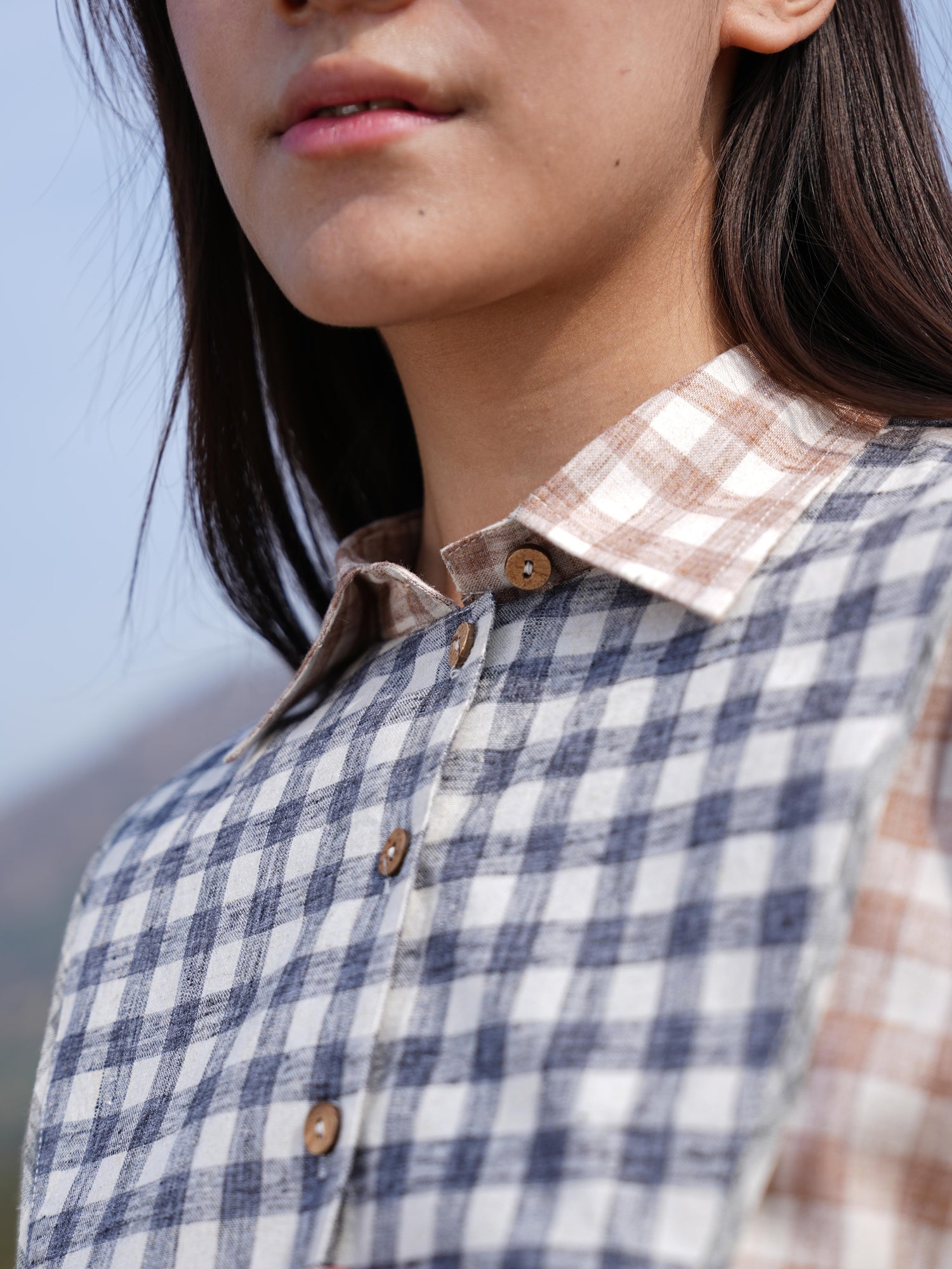 Model styling the checked cotton maxi dress for a warm summer day