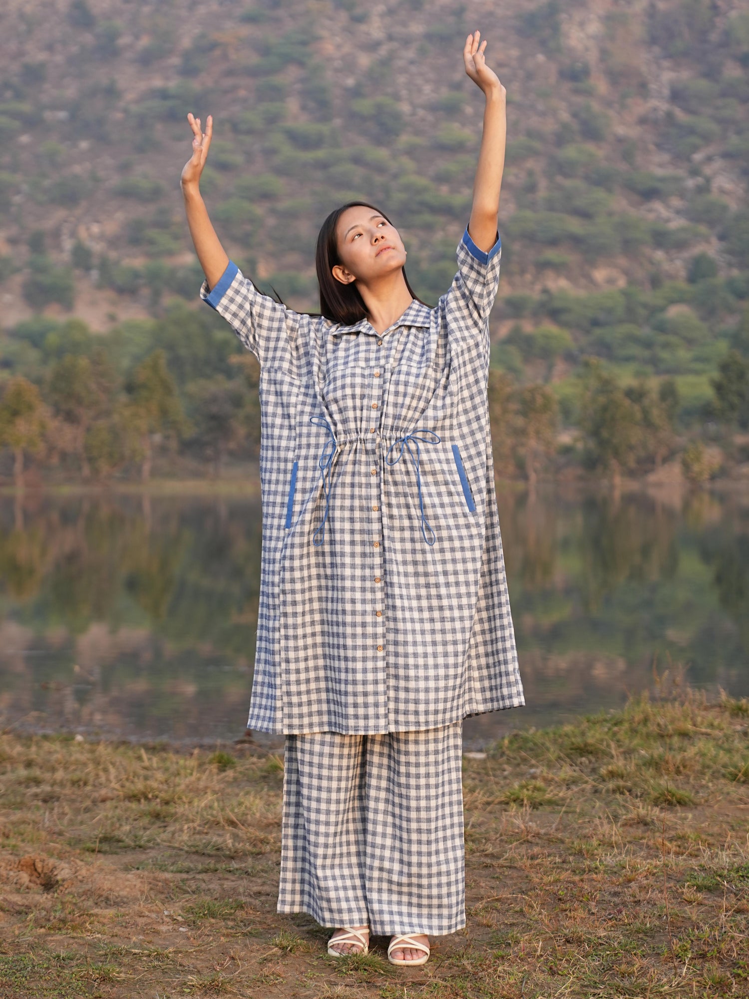 Woman wearing the Sutra Anti-Fit Check co-ord — a boxy checked cotton top with straight palazzo pants