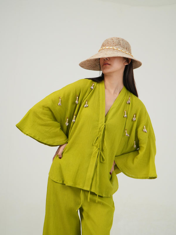 Woman wearing the Vanshitaaz Lime Green crinkled cotton co-ord — a bell-sleeve loose-fit top with wide-leg pants