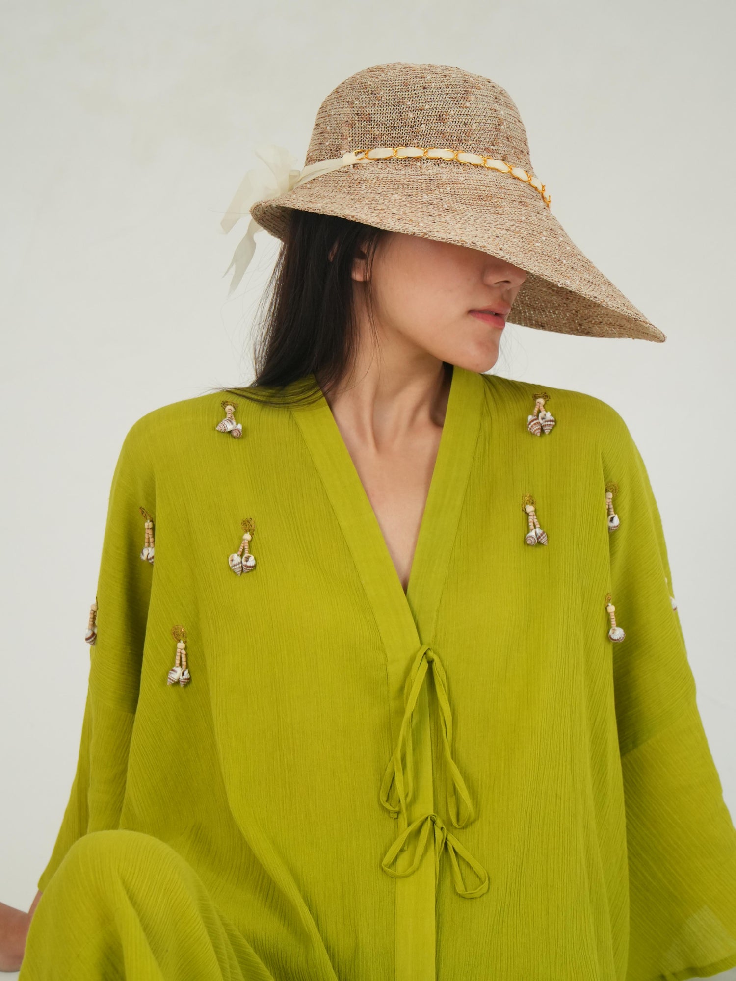 Bell sleeves on the loose-fit crinkled cotton top