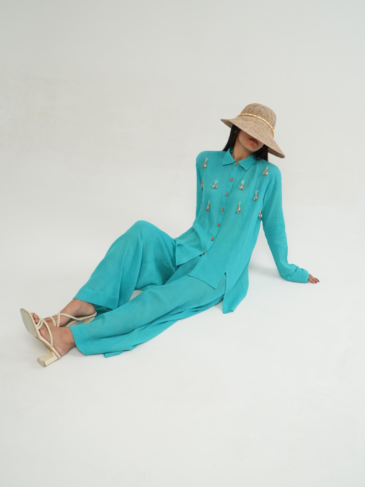 Side profile of the Turquoise crinkled cotton co-ord set, showing its relaxed drape