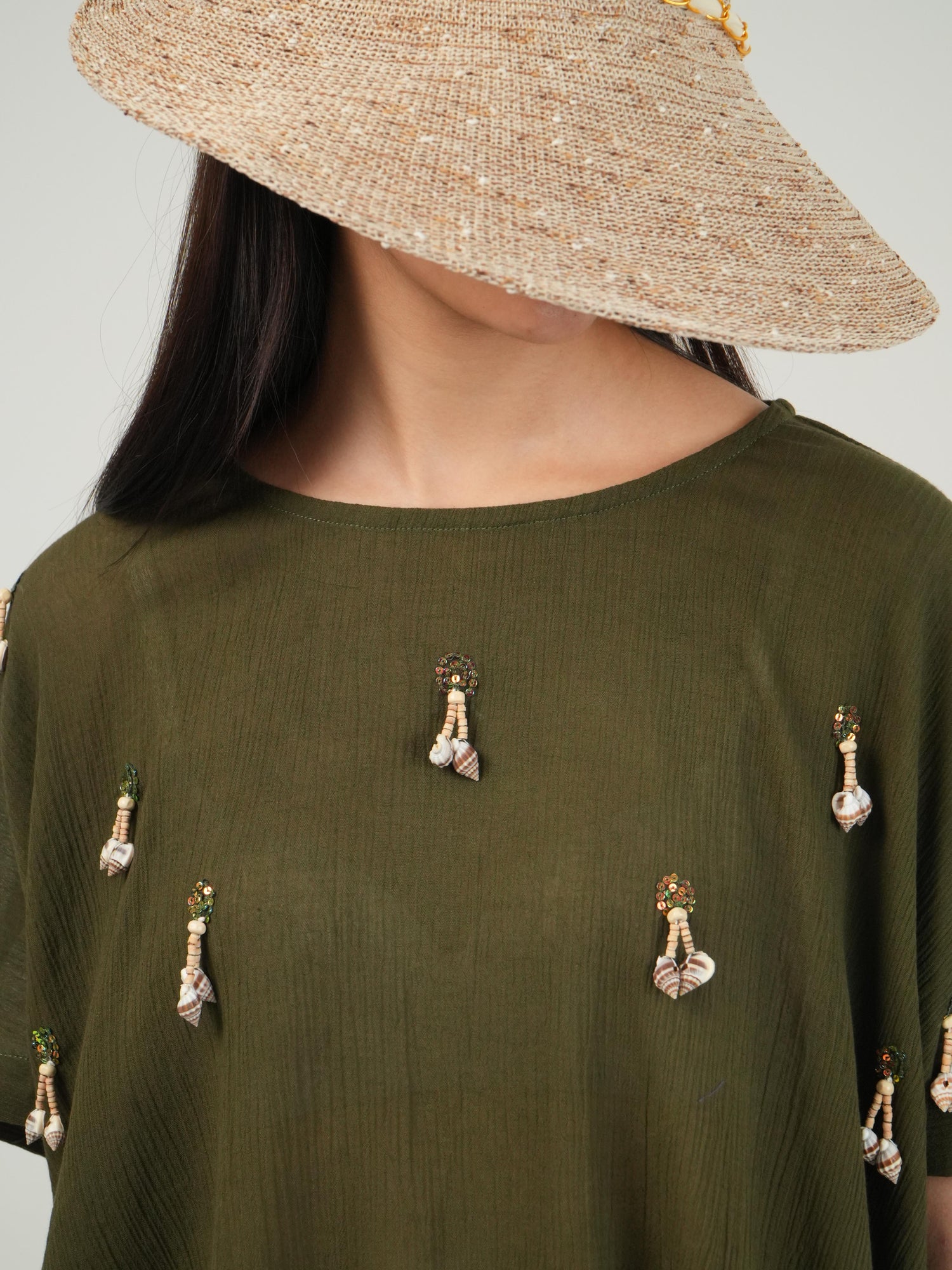 Detail of the hem and tie finish on the Olive crinkled cotton co-ord set