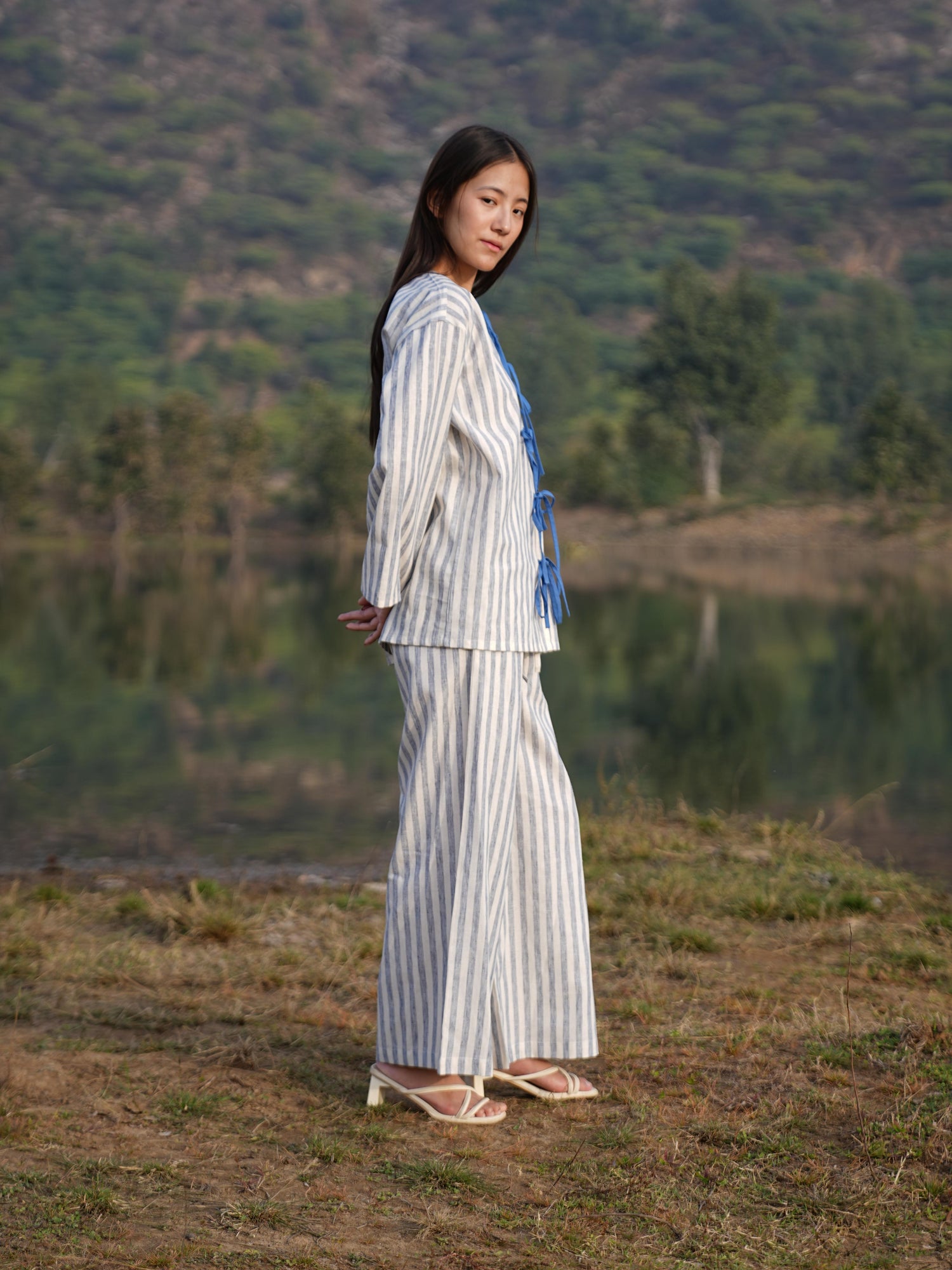 The long-sleeve tunic shown open over the matching striped trousers