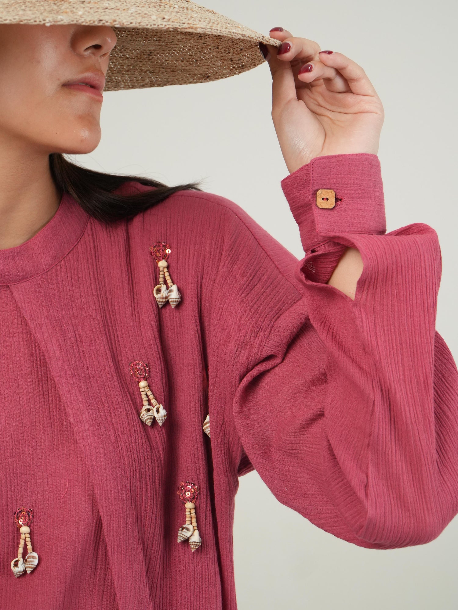 Side profile of the Fruit Dove crinkled cotton co-ord set, showing its relaxed drape