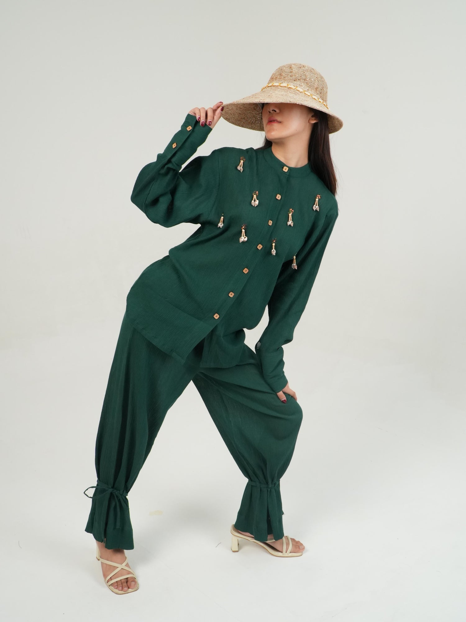 Side profile of the Racing Green crinkled cotton co-ord set, showing its relaxed drape