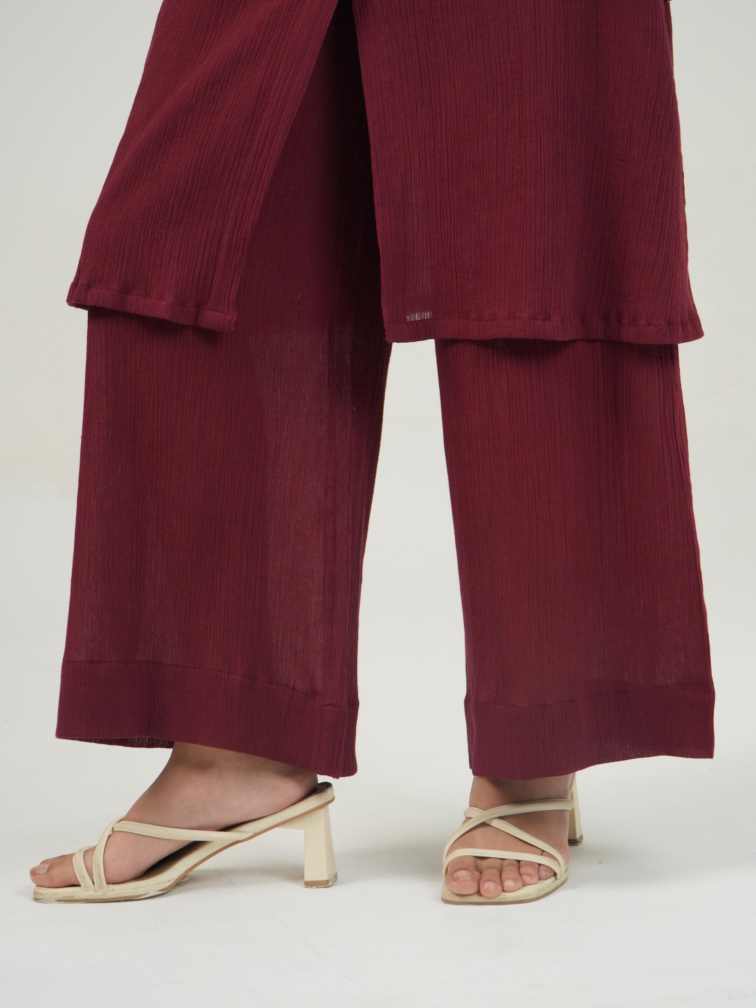 Side profile of the Merlot crinkled cotton co-ord set, showing its relaxed drape