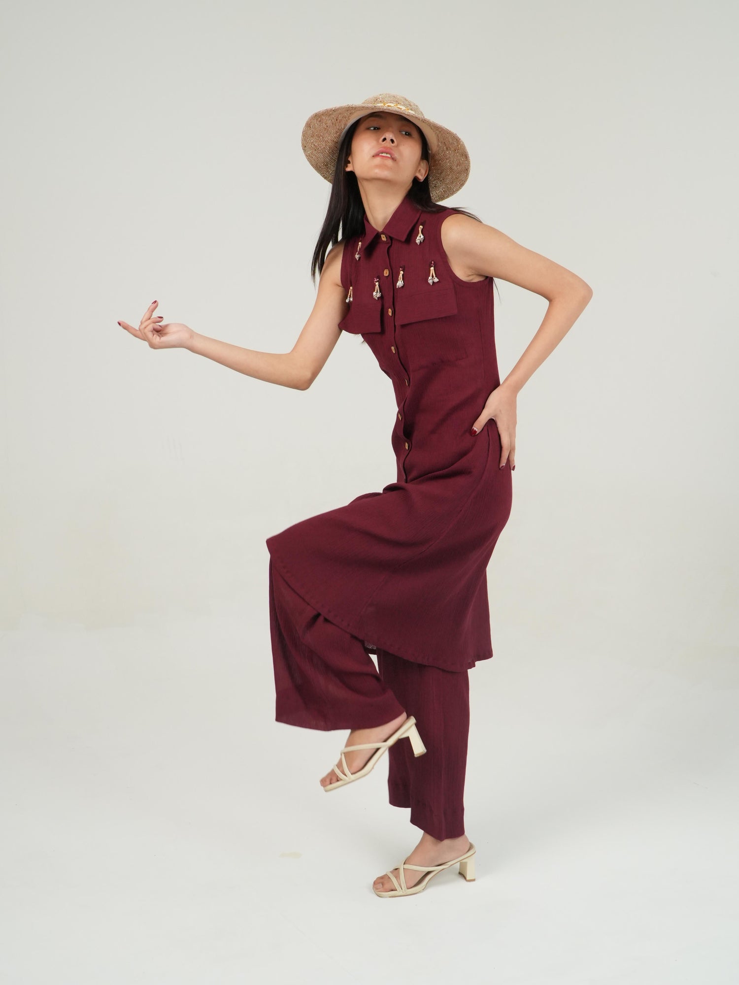Wooden-style button detail on the sleeveless crinkled cotton top