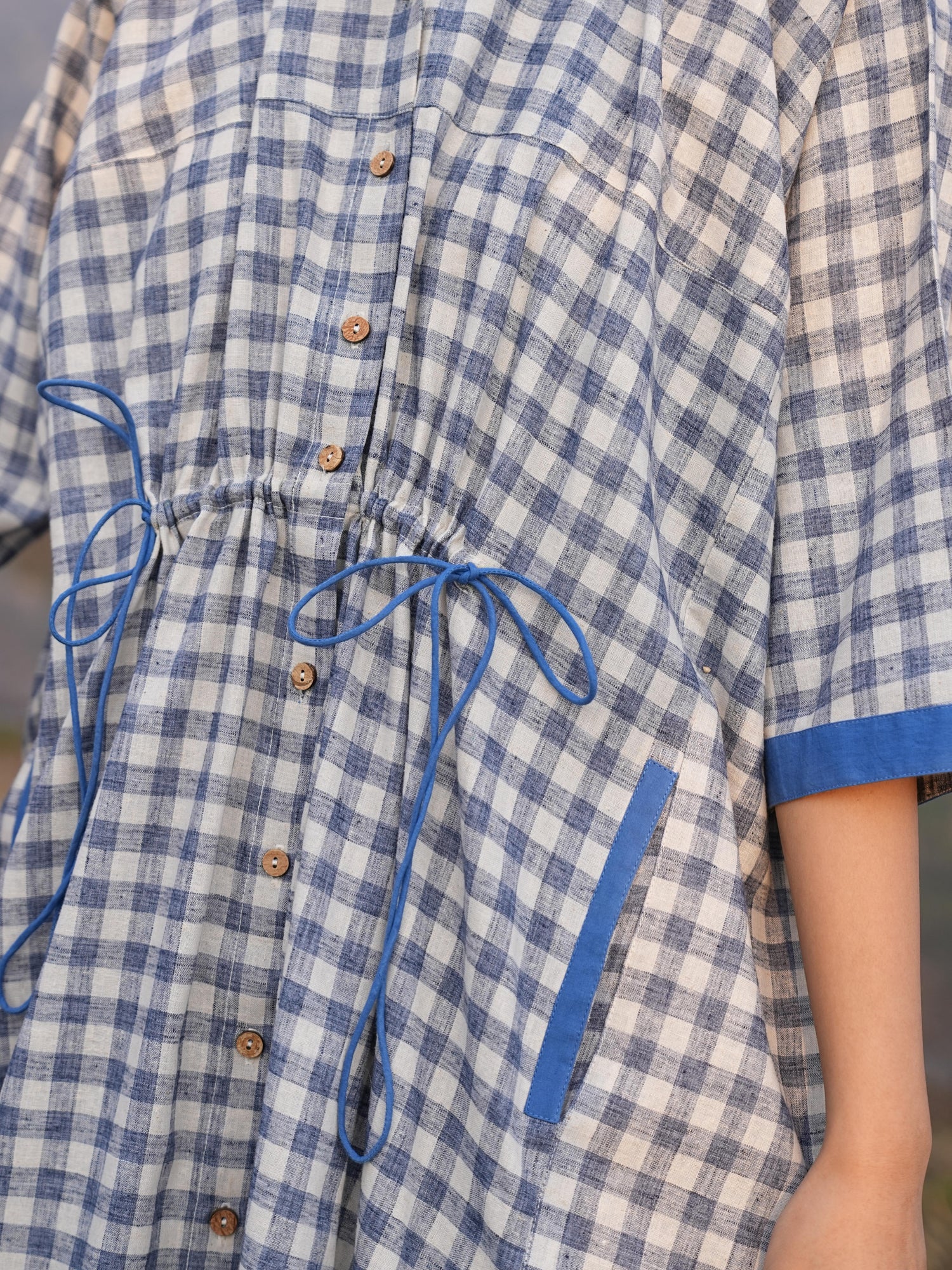 Detail of the clean French-seam finish on the anti-fit checked cotton co-ord set