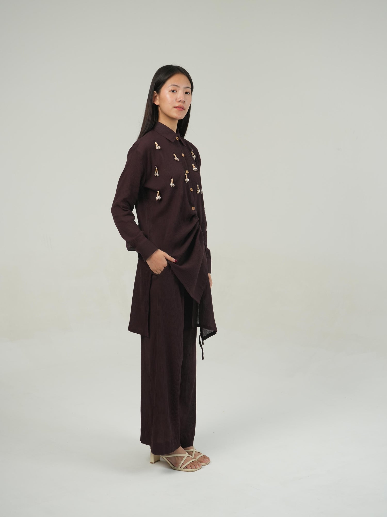 Detail of the hem and tie finish on the Deep Burgundy crinkled cotton co-ord set