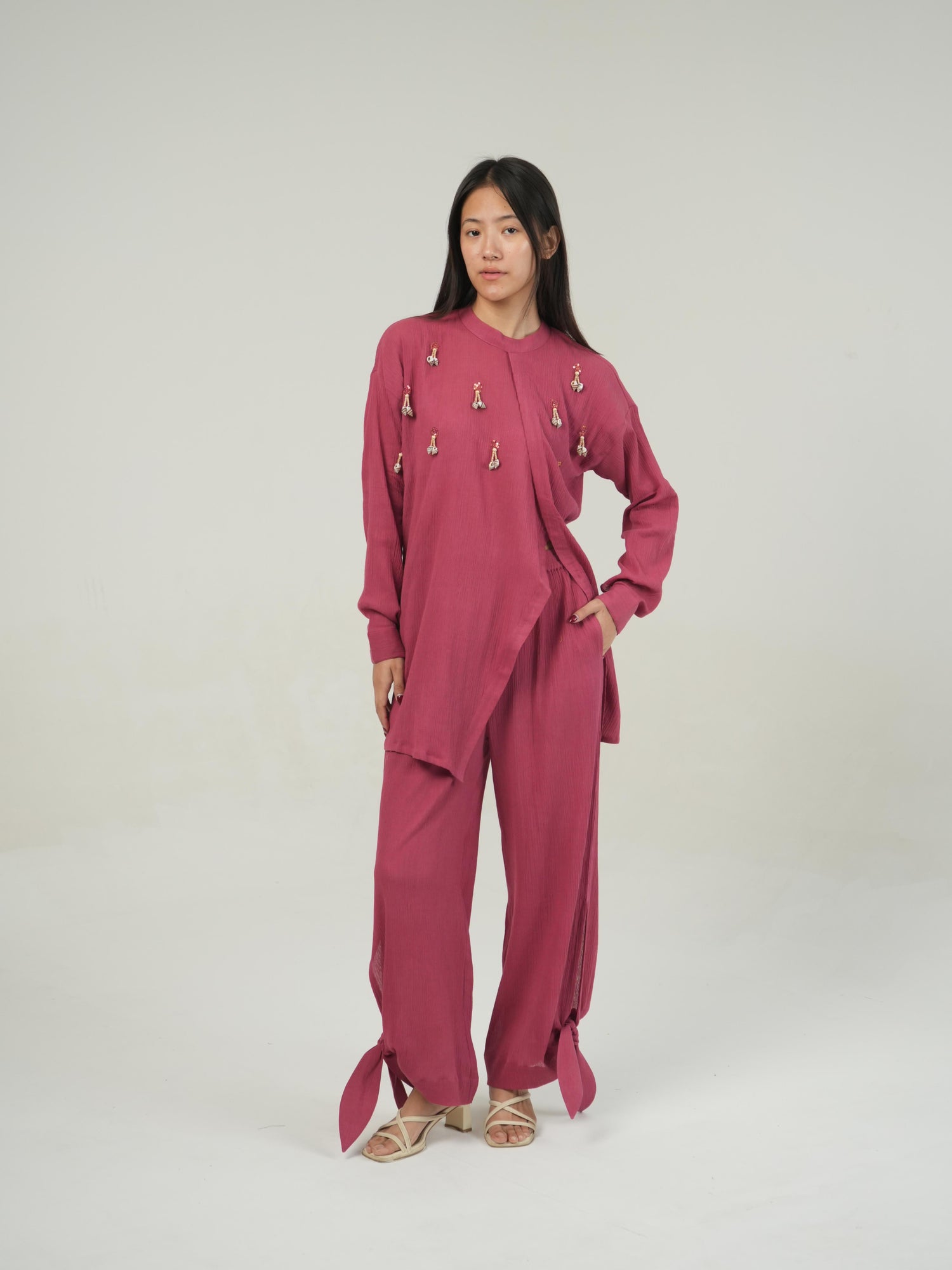 Close-up of the crinkled cotton texture and subtle embellishment