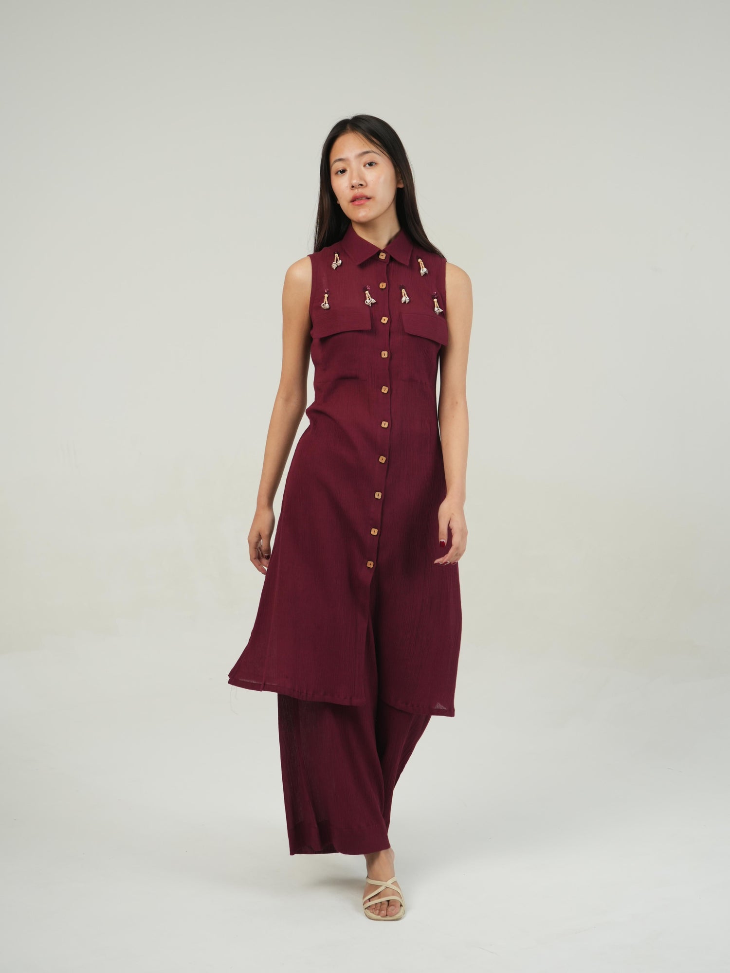 Detail of the hem and tie finish on the Merlot crinkled cotton co-ord set