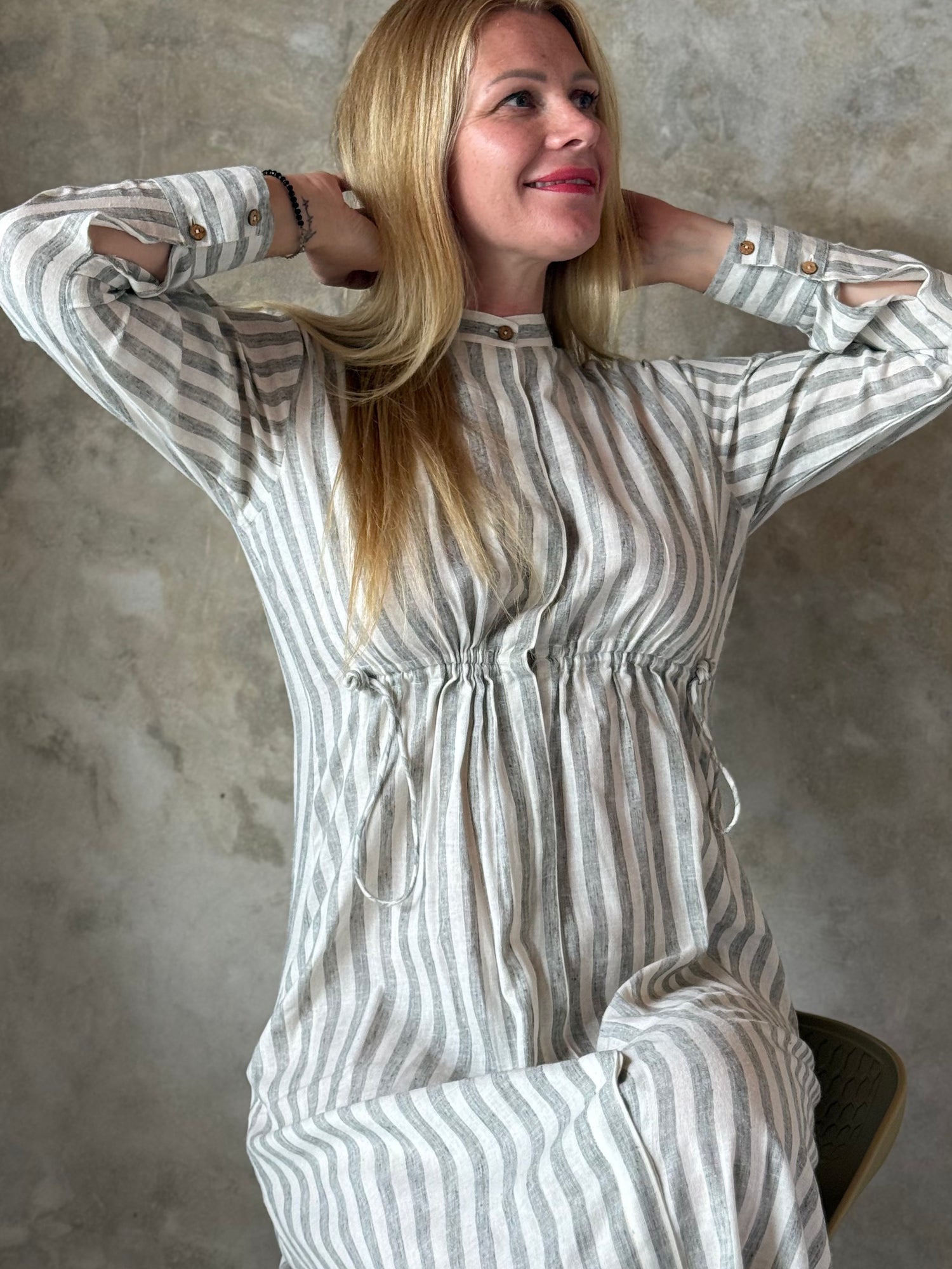 Full-length striped cotton maxi dress shown with a gently cinched waist