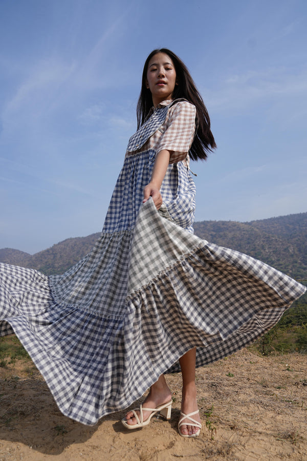 Woman wearing the Sutra 4-Check Maxi Dress — a checked cotton maxi dress with a shirt collar and button placket