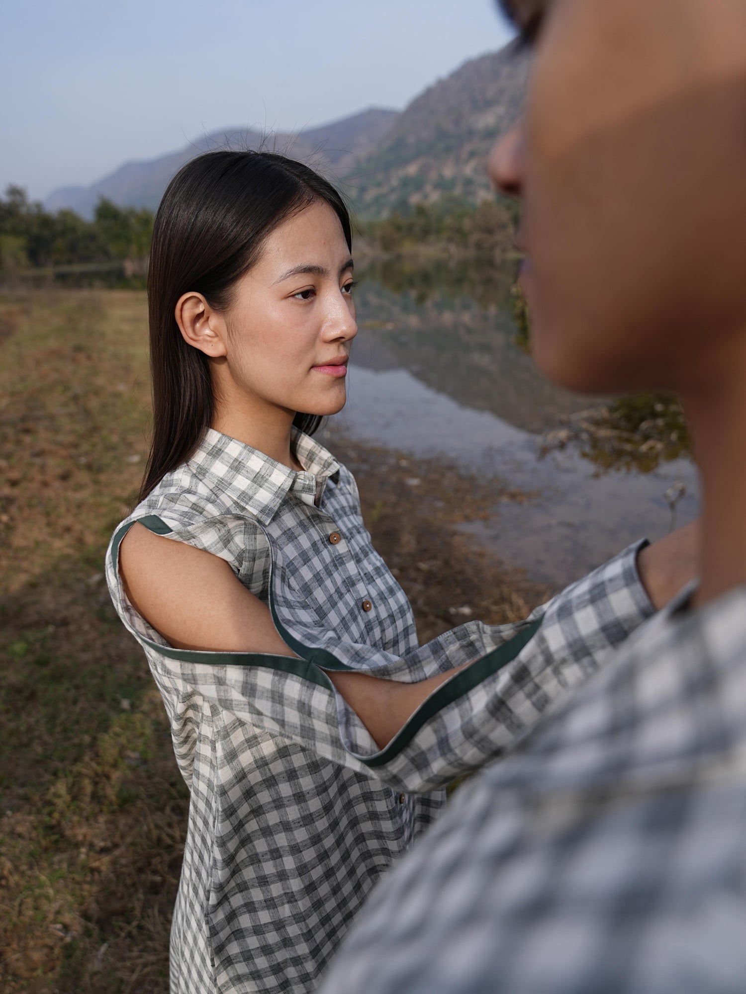 Woman wearing the Sutra A-Line co-ord — a boxy A-line cotton top with green detailing and straight palazzo pants