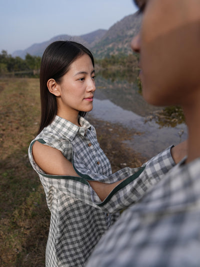Woman wearing the Sutra A-Line co-ord — a boxy A-line cotton top with green detailing and straight palazzo pants
