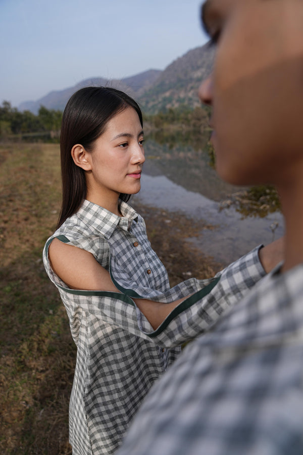 Woman wearing the Sutra A-Line co-ord — a boxy A-line cotton top with green detailing and straight palazzo pants