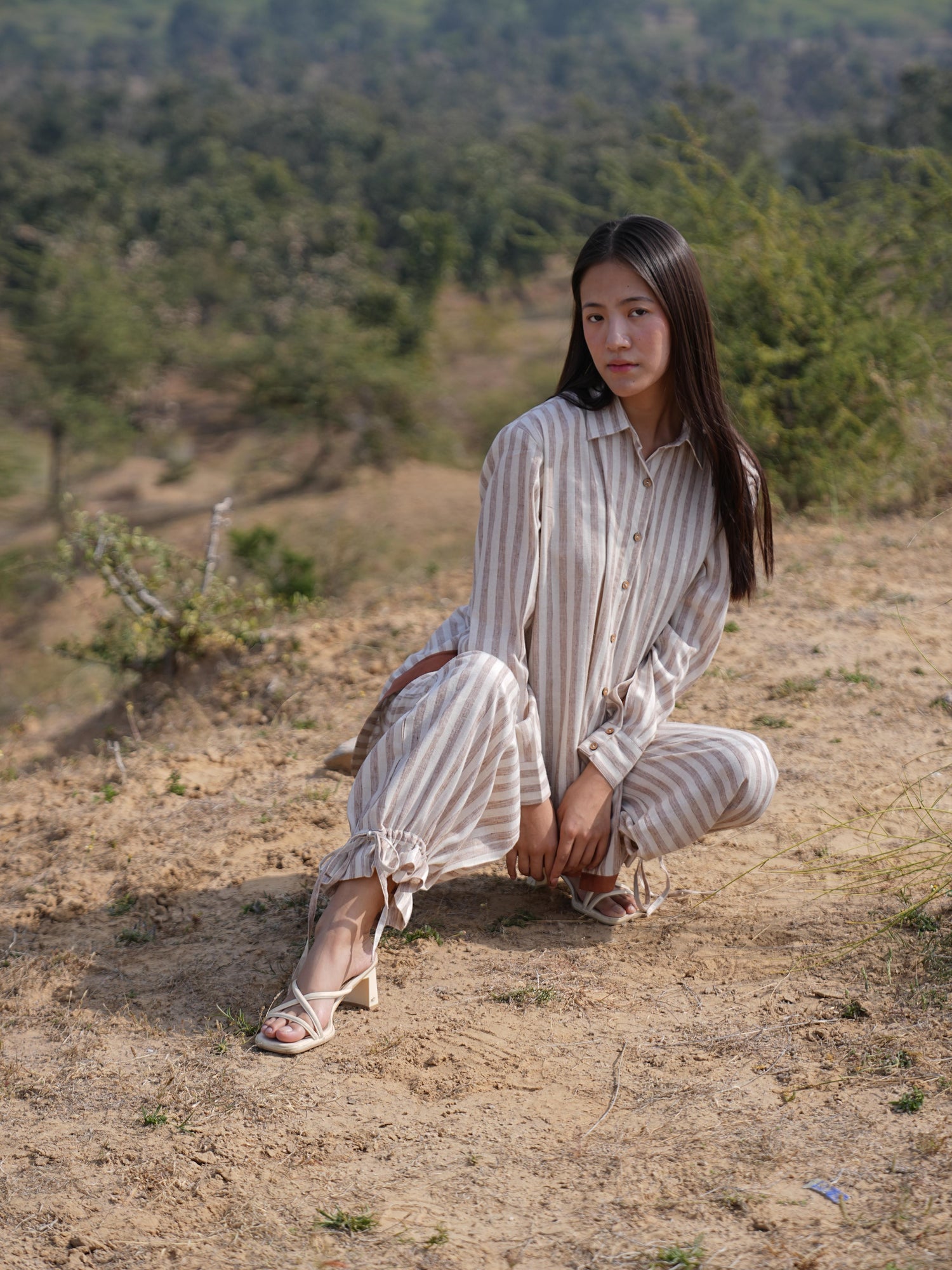 The Arc Stripe shirt worn open and relaxed over the matching trousers