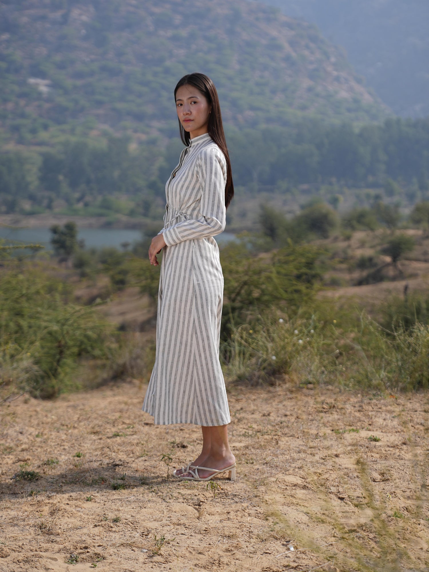 Detail of the clean French-seam finish on the striped cotton maxi dress