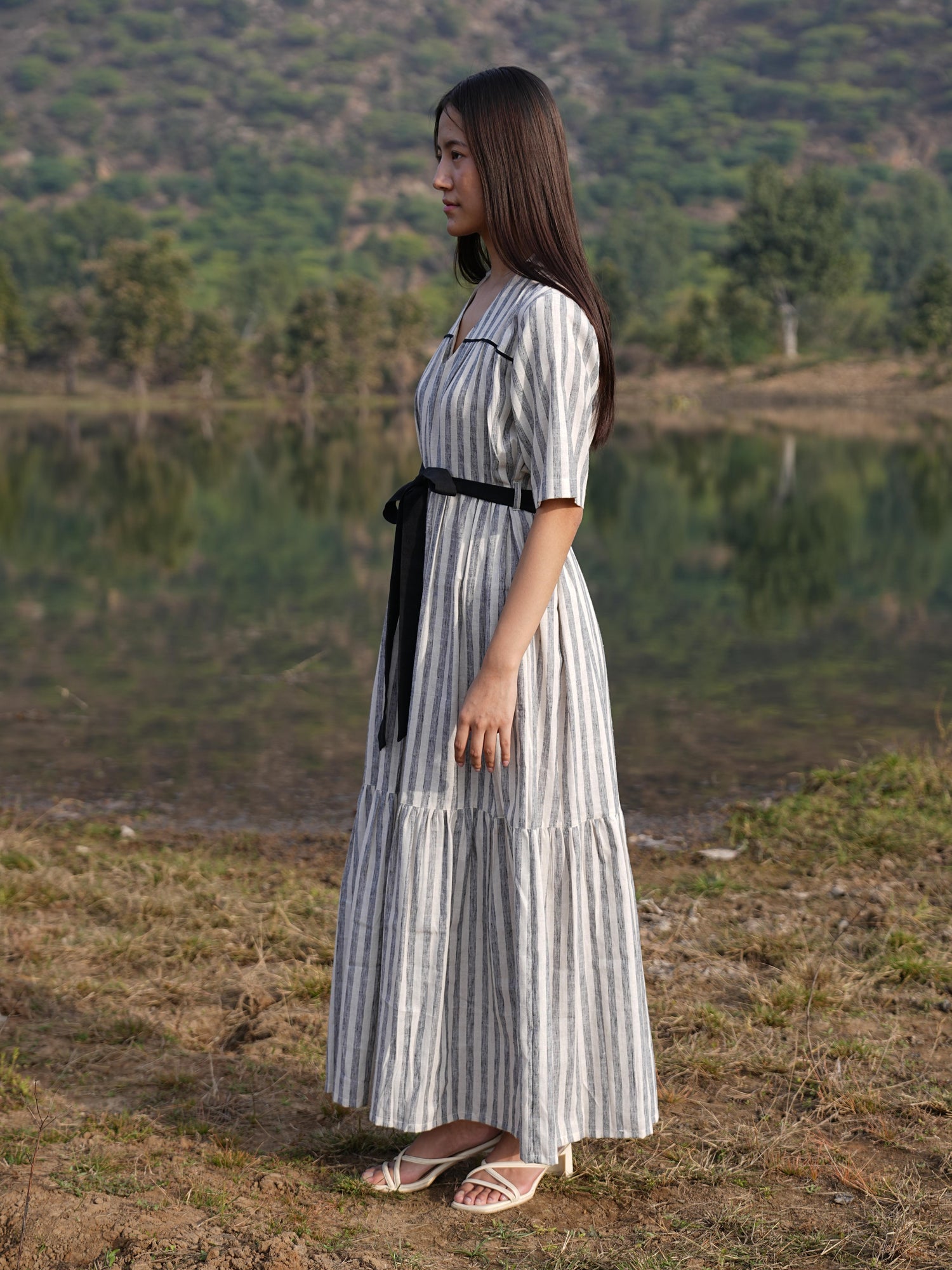 Full-length view of the striped cotton midi dress