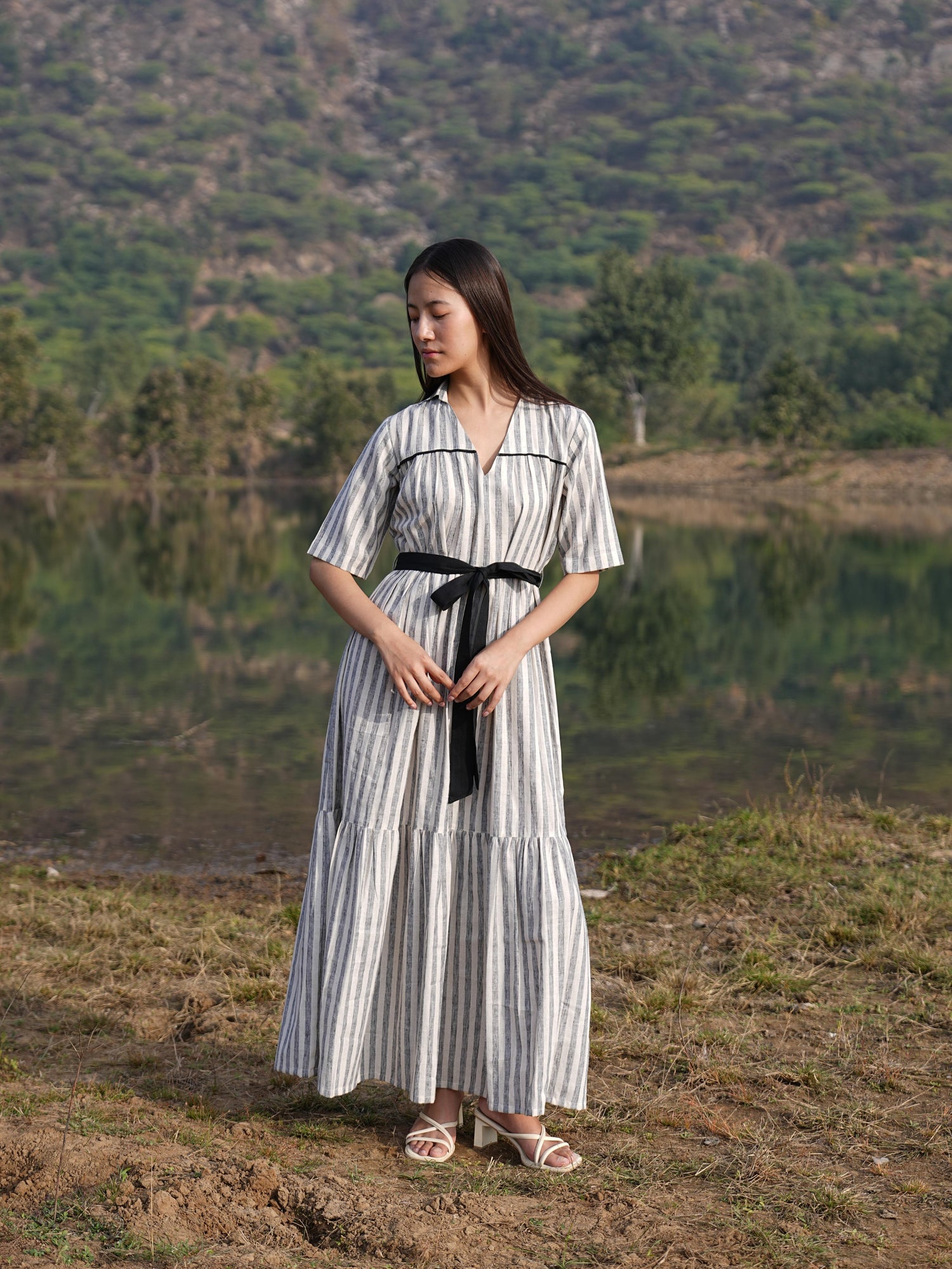 Striped cotton midi dress shown with the belt tied at the waist