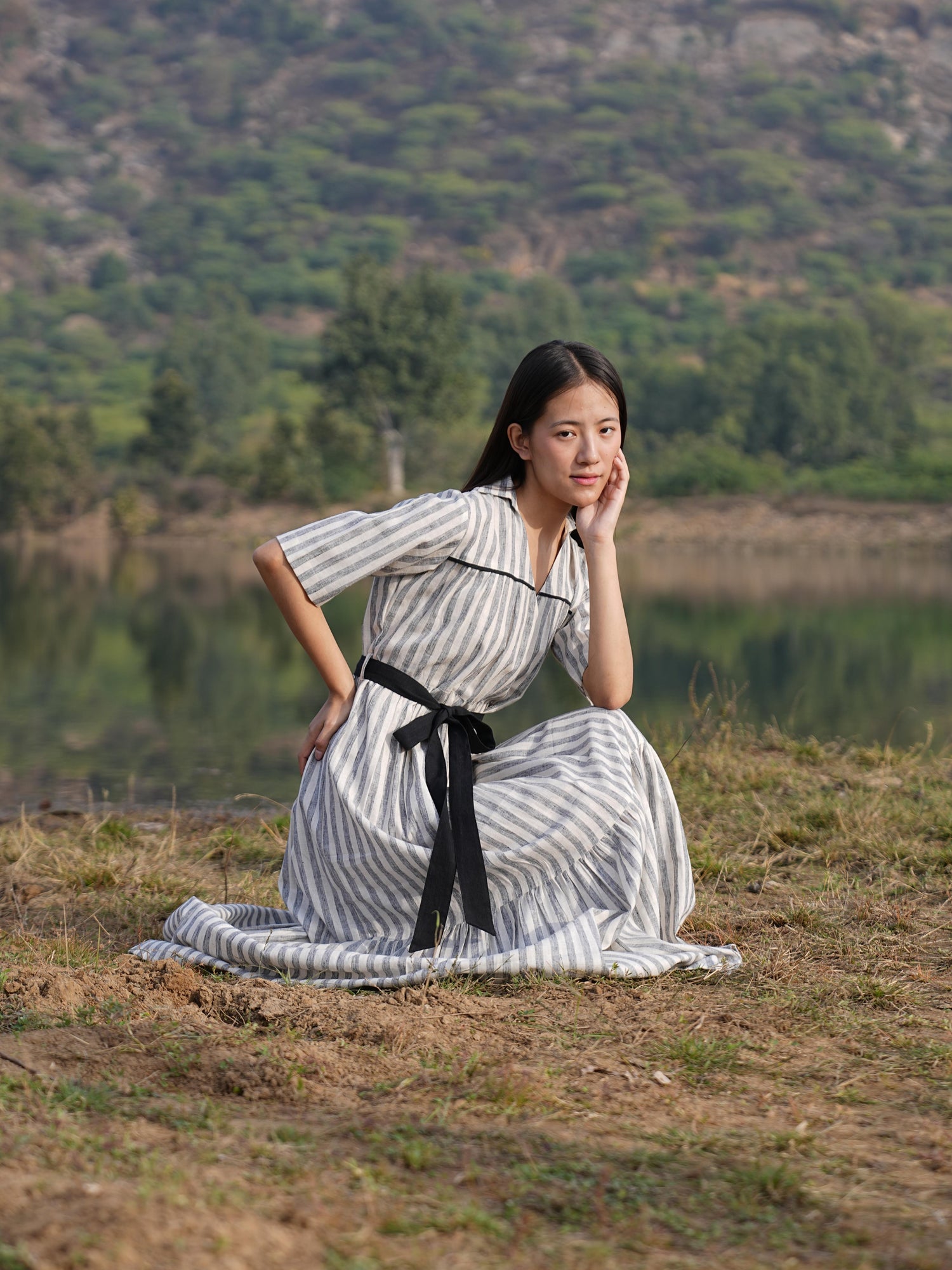 Relaxed, anti-fit striped cotton midi dress shown in natural daylight