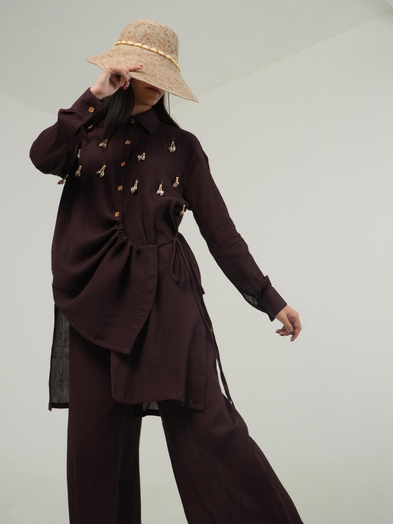 Side profile of the Deep Burgundy crinkled cotton co-ord set, showing its relaxed drape
