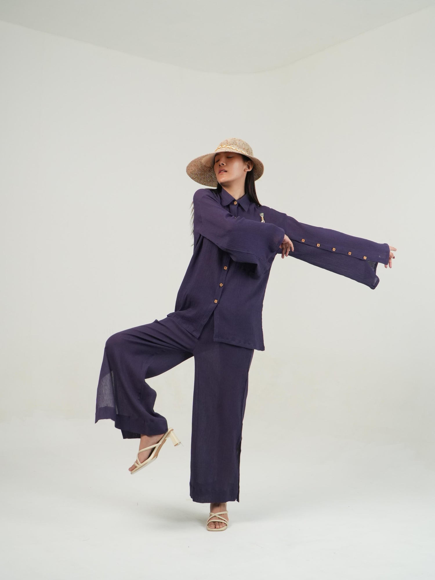 Side profile of the Mulberry Purple crinkled cotton co-ord set, showing its relaxed drape