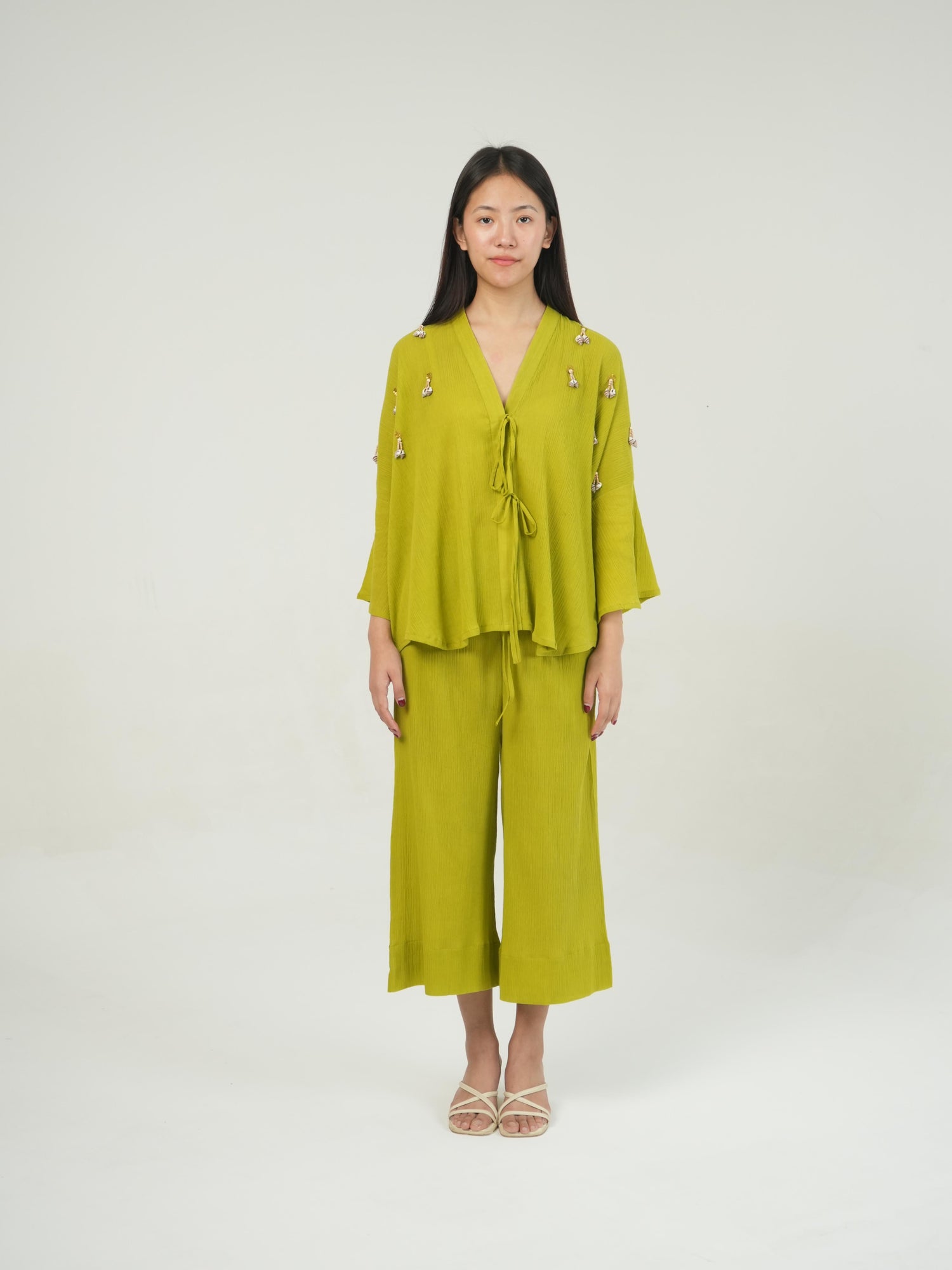 Side profile of the Lime Green crinkled cotton co-ord set, showing its relaxed drape