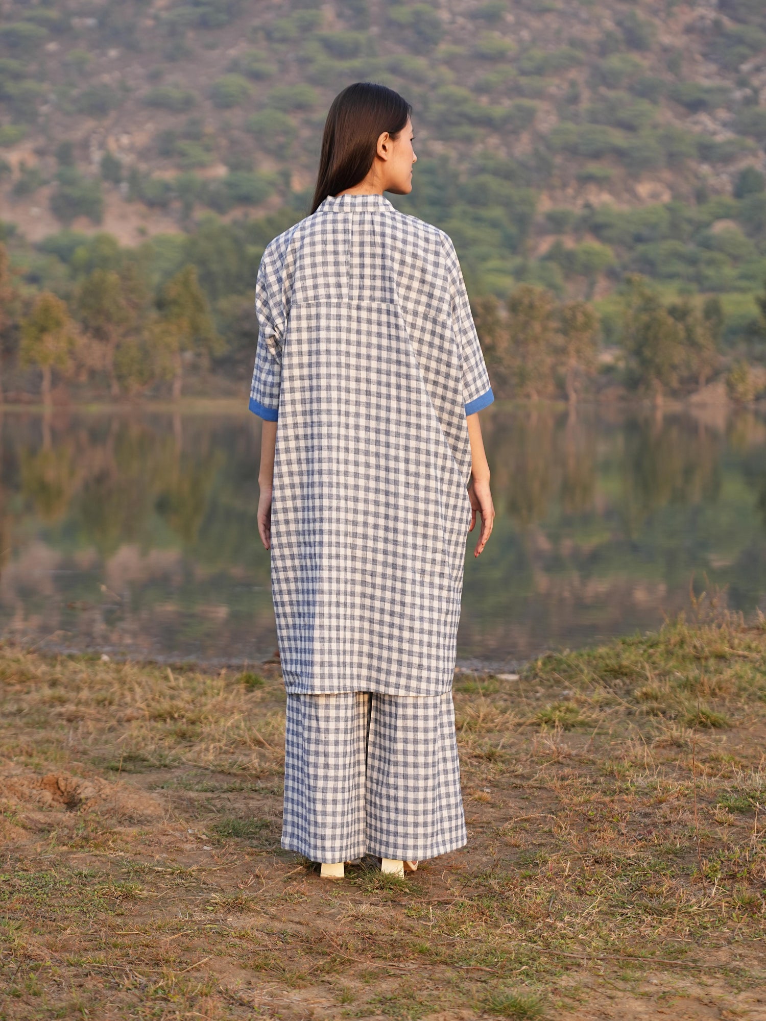 Side profile of the anti-fit checked cotton co-ord set, showing its relaxed drape