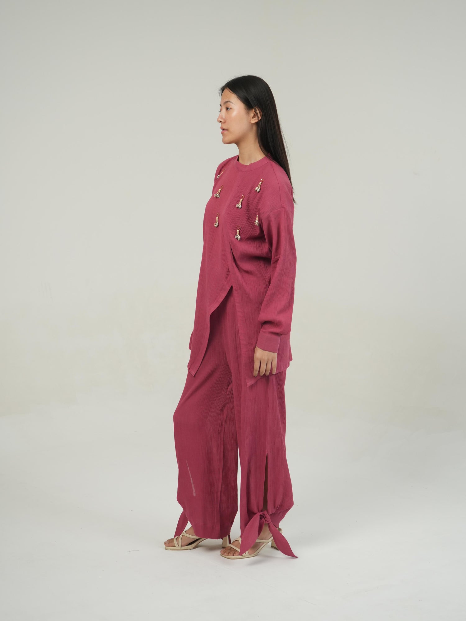 Detail of the hem and tie finish on the Fruit Dove crinkled cotton co-ord set