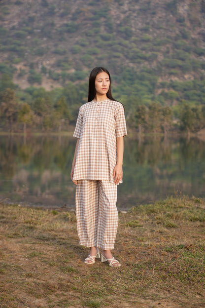 sutra check mandarin co-ord

check co-ord set

mandarin collar co-ord

sutra matching set

check print co-ord

two-piece outfit

sutra co-ord set

casual co-ord set